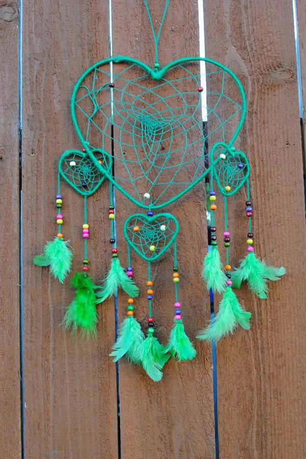 Green heart dreamcatcher with feathers